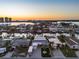 Sunset aerial view of beautiful waterfront homes and calm canals in a scenic coastal neighborhood, perfect for boaters at 17730 Long Point Dr, Redington Shores, FL 33708