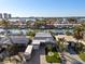 Waterfront home with lush landscaping, a private dock, and a beautiful waterfront view of the surrounding community at 17730 Long Point Dr, Redington Shores, FL 33708