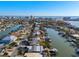 Expansive aerial view of a coastal community with waterfront homes, private docks, and tranquil canals leading to the ocean at 17730 Long Point Dr, Redington Shores, FL 33708