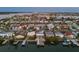 Stunning aerial view of waterfront homes with private docks and boatlifts along the serene canals and coastal community at 17730 Long Point Dr, Redington Shores, FL 33708