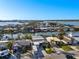 Picturesque aerial view of waterfront homes with boat docks nestled along peaceful canals in a charming coastal neighborhood at 17730 Long Point Dr, Redington Shores, FL 33708