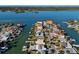 An aerial view of canal-front homes, each featuring private boat docks and access to the serene waterways at 17730 Long Point Dr, Redington Shores, FL 33708