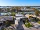Aerial view showing well-maintained homes with canal access and private docks at 17730 Long Point Dr, Redington Shores, FL 33708