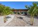 Beautiful backyard featuring a covered patio, lush tropical landscaping, and attractive walkway at 17730 Long Point Dr, Redington Shores, FL 33708