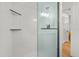 Modern shower with glass enclosure, tile surround, and built-in shelving at 17730 Long Point Dr, Redington Shores, FL 33708