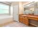 Bathroom featuring a single sink vanity, large mirror, shower and separate bathtub, and tiled floors at 18310 Bankston Pl, Tampa, FL 33647