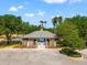 Community clubhouse and pool area with gated entry, well-maintained landscaping, and ample parking at 18310 Bankston Pl, Tampa, FL 33647