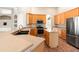 Well-equipped kitchen with tile floors, ample cabinet space, and stainless steel refrigerator at 18310 Bankston Pl, Tampa, FL 33647