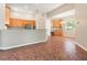 Well-lit kitchen featuring tile flooring, light-colored cabinets, and stainless steel appliances at 18310 Bankston Pl, Tampa, FL 33647