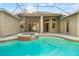 Beautiful pool and spa surrounded by a screened enclosure and offering stunning views at 18310 Bankston Pl, Tampa, FL 33647