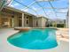 Beautiful pool area featuring a built-in spa, screened enclosure, and inviting blue water at 18310 Bankston Pl, Tampa, FL 33647
