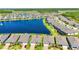 Aerial view featuring backyards and lakes in a beautiful neighborhood with green landscaping at 19442 Sea Glass Cir, Land O Lakes, FL 34638