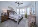 Cozy bedroom featuring a bay window with shutters and a ceiling fan at 19442 Sea Glass Cir, Land O Lakes, FL 34638