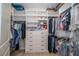 Walk-in closet with custom shelving, drawers and ample storage, perfect for organization at 19442 Sea Glass Cir, Land O Lakes, FL 34638