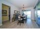 Dining room with a chandelier and sliding glass doors leading to the patio at 19442 Sea Glass Cir, Land O Lakes, FL 34638