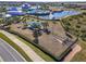 Aerial view of community dog park featuring a shaded area, play structure, and plenty of space for dogs to run and play at 19442 Sea Glass Cir, Land O Lakes, FL 34638