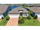 Beautifully landscaped single-Gathering home with a two-car garage and water view at 19442 Sea Glass Cir, Land O Lakes, FL 34638