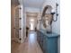 Hallway view of front door, interior decor, wood floors, and french doors at 19442 Sea Glass Cir, Land O Lakes, FL 34638