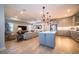 Open-concept kitchen with a center island, stainless steel appliances, and pendant lighting at 19442 Sea Glass Cir, Land O Lakes, FL 34638