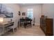 Comfortable office space with a piano and a large picture window at 19442 Sea Glass Cir, Land O Lakes, FL 34638