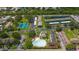 An overhead shot of a community with a pool, playground, tennis courts, and parking for the residents at 195 114Th Ne Ave # 195, St Petersburg, FL 33716