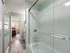 Bathroom with shower and tub combination, with a view into a bedroom at 195 114Th Ne Ave # 195, St Petersburg, FL 33716