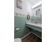 Bathroom with tile accents, white countertop sink, and white toilet at 195 114Th Ne Ave # 195, St Petersburg, FL 33716