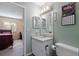 Bathroom with granite countertops, a toilet, and a view into a bedroom at 195 114Th Ne Ave # 195, St Petersburg, FL 33716