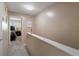 Upstairs hallway with carpet, leads to a bedroom with a view of a bed and dresser at 195 114Th Ne Ave # 195, St Petersburg, FL 33716