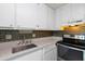 Well-lit kitchen featuring stainless steel appliances, modern countertops, and ample storage space at 195 114Th Ne Ave # 195, St Petersburg, FL 33716