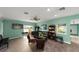 Inviting living room featuring comfortable seating, a ceiling fan, and a wall-mounted TV for relaxing entertainment at 195 114Th Ne Ave # 195, St Petersburg, FL 33716