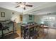 Inviting living room with wood floors, dining table and a comfortable sitting area by the sliding door at 195 114Th Ne Ave # 195, St Petersburg, FL 33716