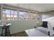 Enclosed porch with a ping pong table and a view of the community at 195 114Th Ne Ave # 195, St Petersburg, FL 33716