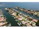 Gorgeous waterfront property featuring a private boat dock with direct access to the bay, and lush landscaping at 2015 Hawaii Ne Ave, St Petersburg, FL 33703