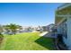 Waterfront backyard features lush lawn, boat dock, and stunning water views, perfect for outdoor enjoyment at 2015 Hawaii Ne Ave, St Petersburg, FL 33703