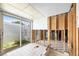 Bathroom under renovation featuring glass sliding doors and water drainage at 2015 Hawaii Ne Ave, St Petersburg, FL 33703