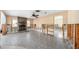 Spacious living room with stone fireplace and exposed framework during home renovation at 2015 Hawaii Ne Ave, St Petersburg, FL 33703
