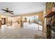 Open floor plan living room under renovation with fireplace, tile flooring, and natural light at 2015 Hawaii Ne Ave, St Petersburg, FL 33703