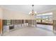 Open living room space with chandelier and water views, ready for customization and restoration at 2015 Hawaii Ne Ave, St Petersburg, FL 33703