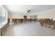 Spacious living room with large windows and ample natural light, awaiting personalization and renovation at 2015 Hawaii Ne Ave, St Petersburg, FL 33703