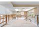 Bright, open living area under renovation, featuring tile floors and multiple entrances to other rooms at 2015 Hawaii Ne Ave, St Petersburg, FL 33703