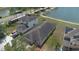 Aerial view of residential homes with neat landscaping and proximity to a tranquil lake setting at 20606 Whitewood Way, Tampa, FL 33647