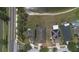 An aerial shot of homes near a tranquil lake, highlighting its setting and nearby community features at 20606 Whitewood Way, Tampa, FL 33647