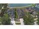 Aerial view of lovely homes, showing driveways, landscaping, and proximity to a scenic lake at 20606 Whitewood Way, Tampa, FL 33647
