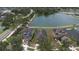 An aerial view showcasing a home's proximity to a serene lake in a well-maintained neighborhood at 20606 Whitewood Way, Tampa, FL 33647