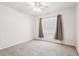 Bedroom with carpeted floor, a window, and a ceiling fan at 20606 Whitewood Way, Tampa, FL 33647