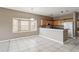 Bright kitchen featuring breakfast bar, white appliances, and ample counter space at 20606 Whitewood Way, Tampa, FL 33647