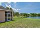 Relaxing lake view from the screened lanai and expansive backyard at 20606 Whitewood Way, Tampa, FL 33647