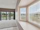 Bright living room with large windows offering beautiful lake views and natural light at 20606 Whitewood Way, Tampa, FL 33647