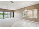 Spacious living area features sliding glass doors to the backyard and scenic water views at 20606 Whitewood Way, Tampa, FL 33647